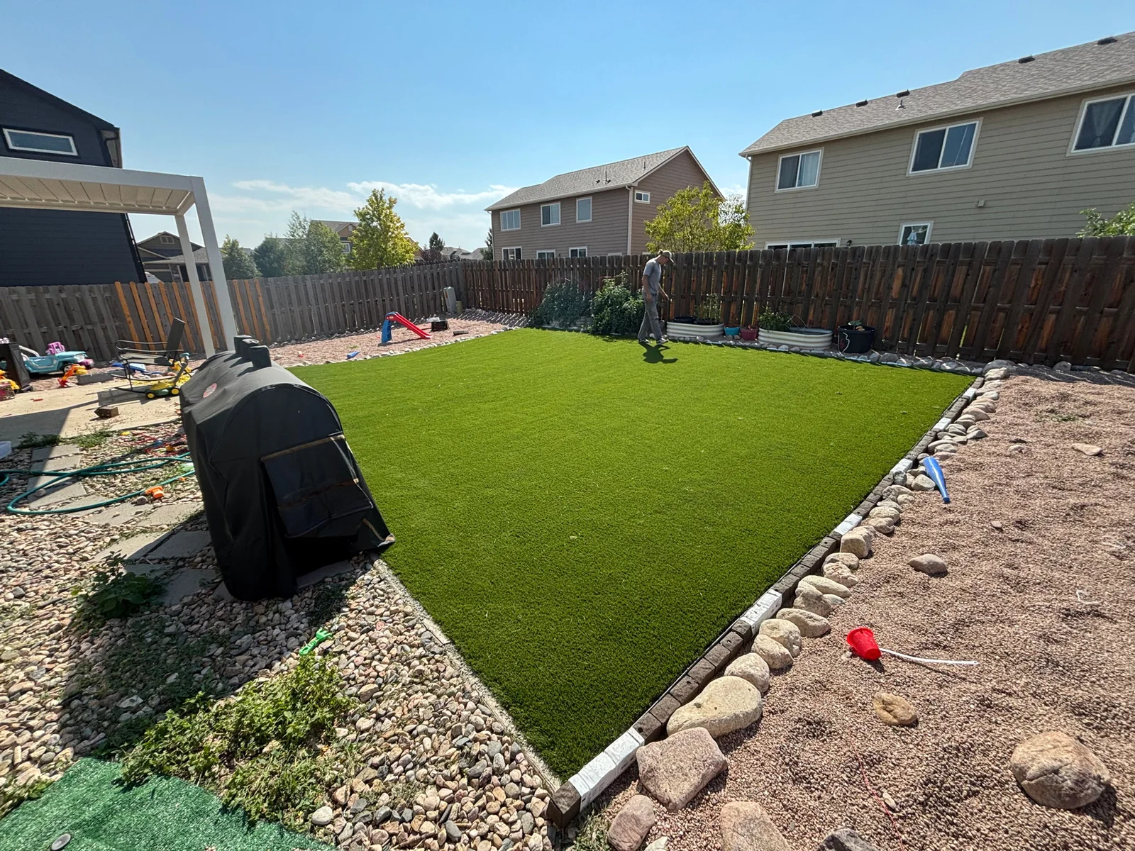 Backyard turf with a river-rock border